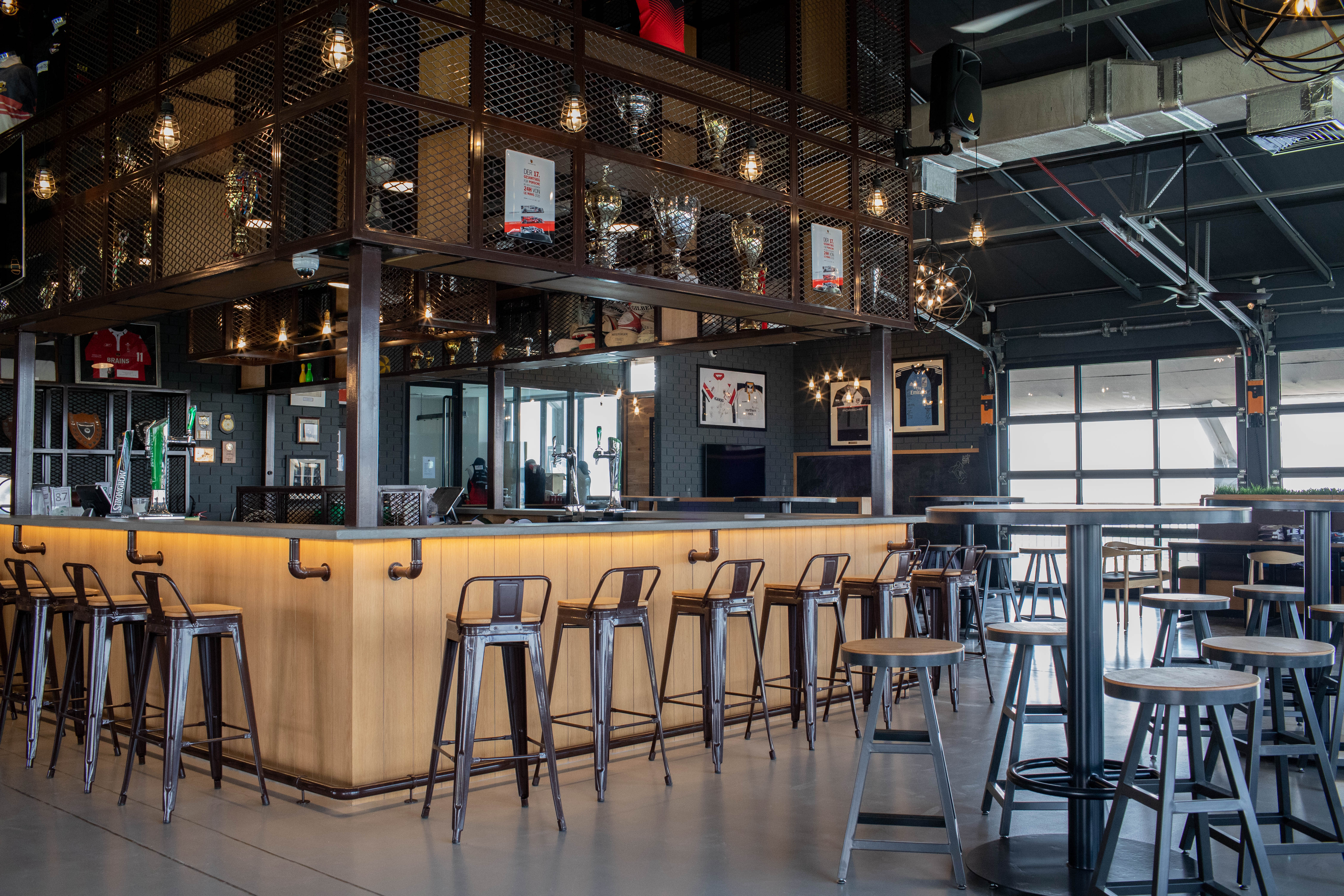 EDGE Architects uses the vintage industrial  style  for Dubai Exiles Rugby Clubhouse Design  